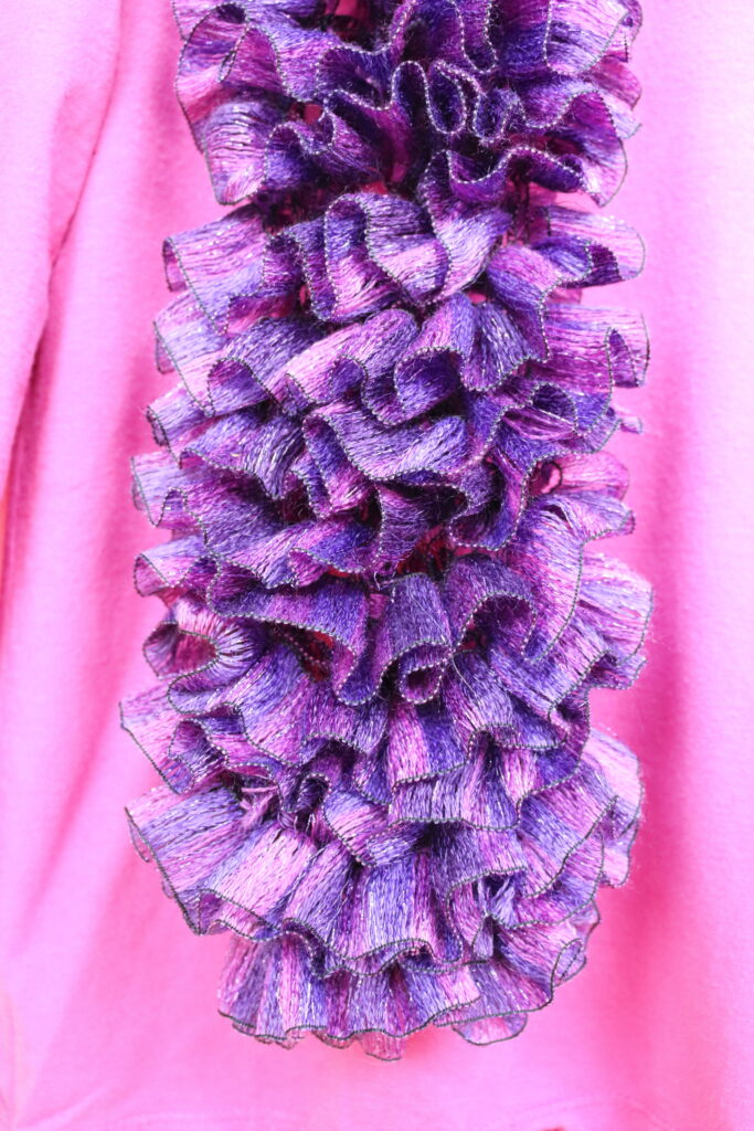 pink and purple knitted scarf closeup