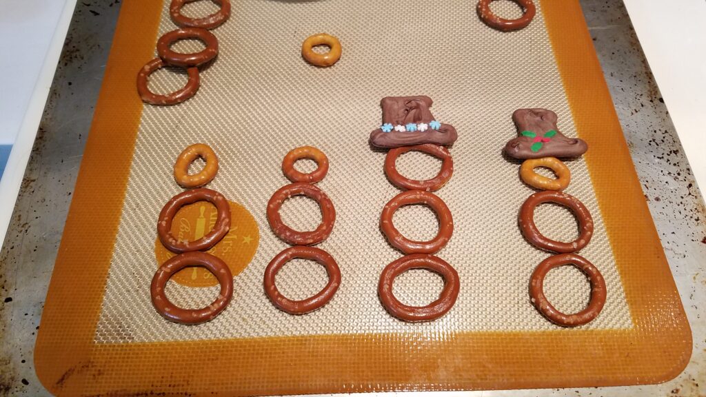 pretzels arranged like snowmen