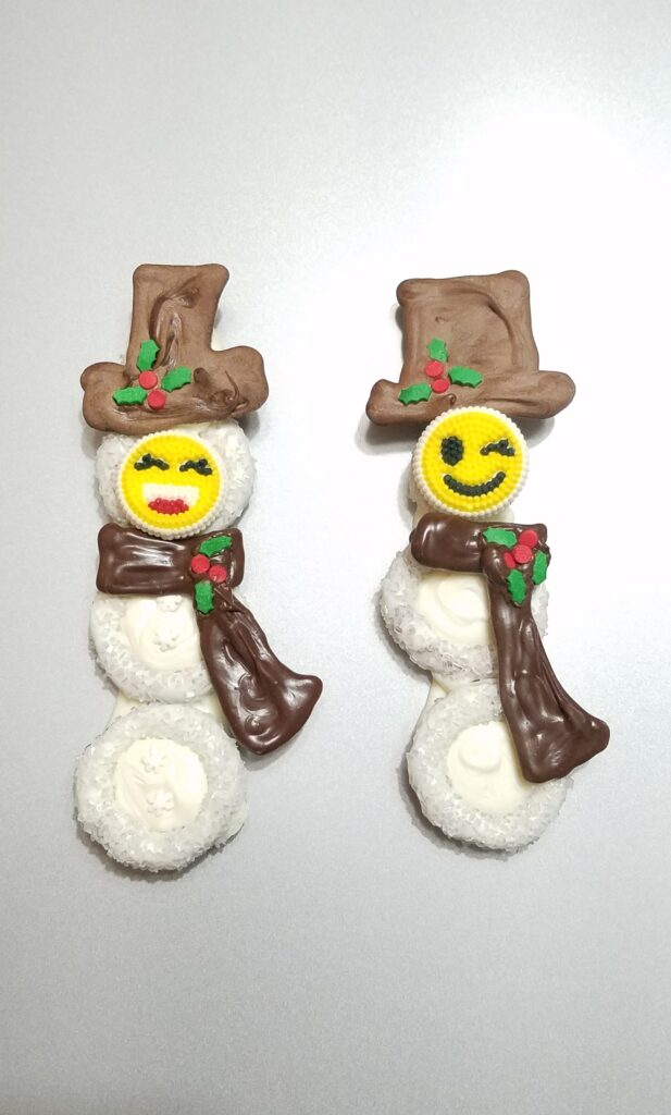 chocolate covered snowmen with emoji faces