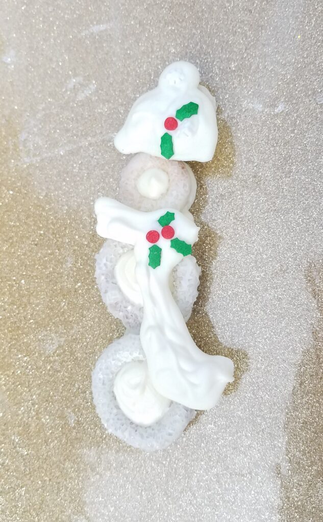 snowman pretzel covered in white chocolate