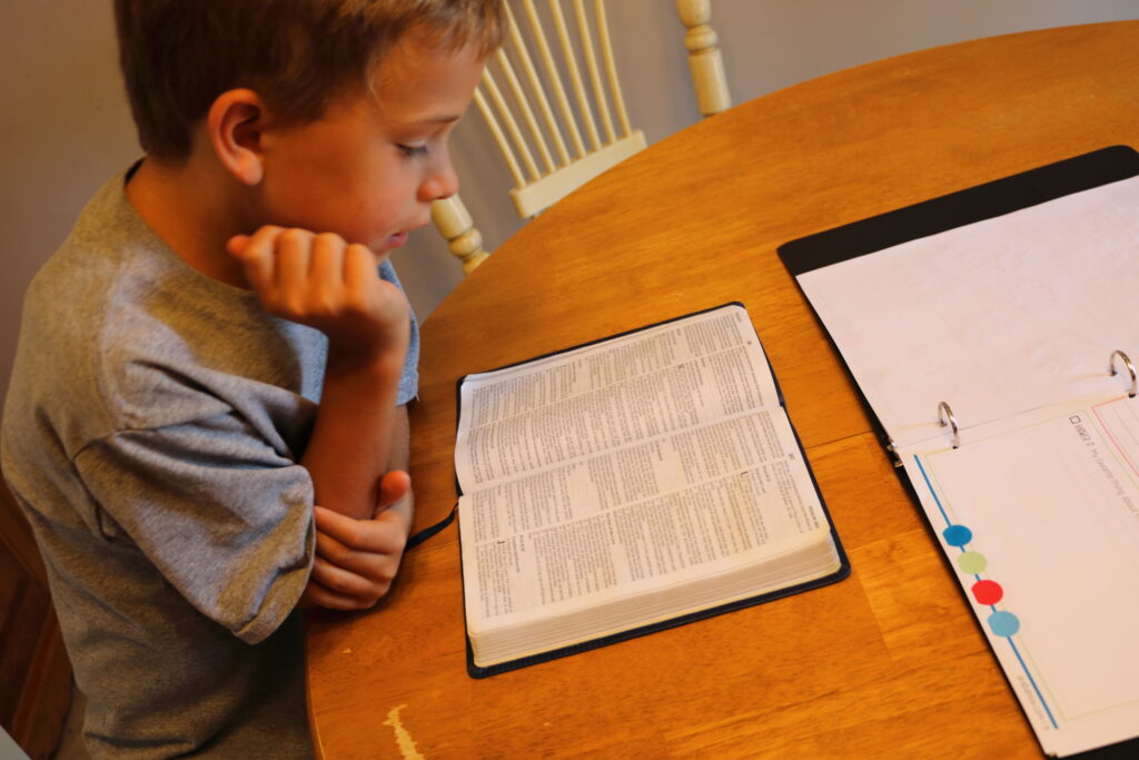 boy reading Bible