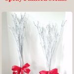 white dried stems with red ribbon