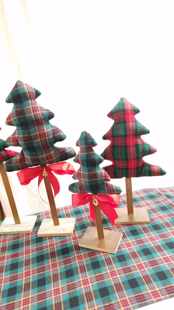 red ribbon on fabric Christmas trees