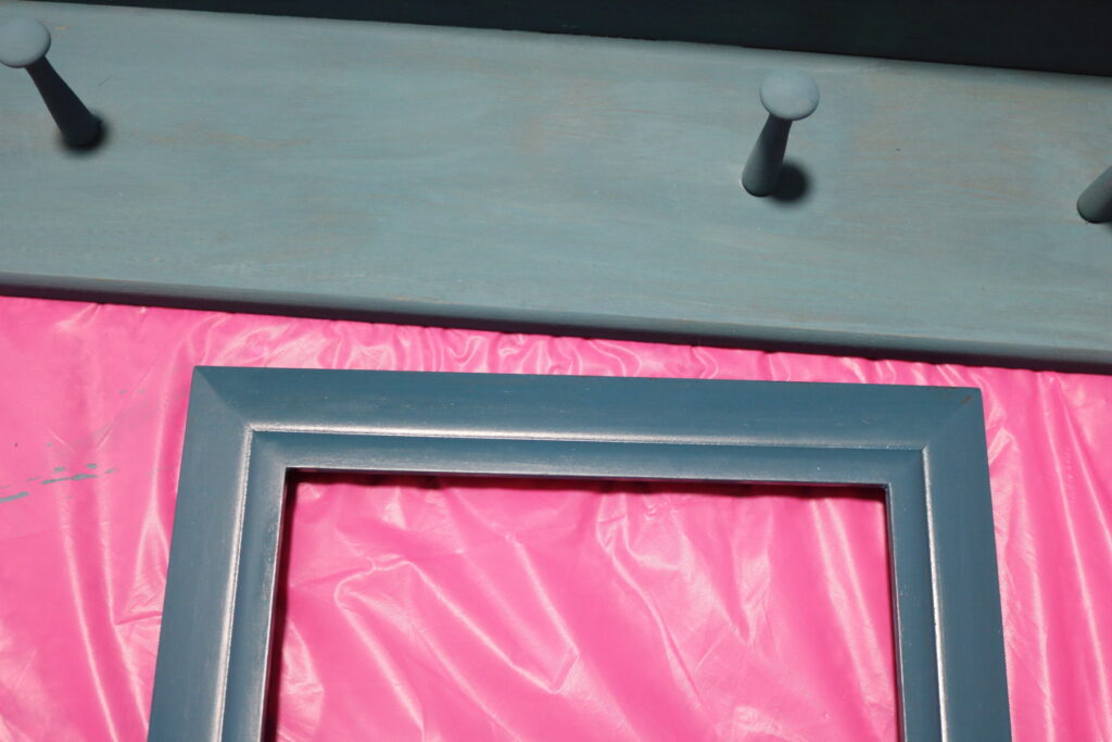 blue picture frame and blue wall shelf