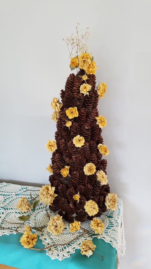 yellow rose pine cone tree