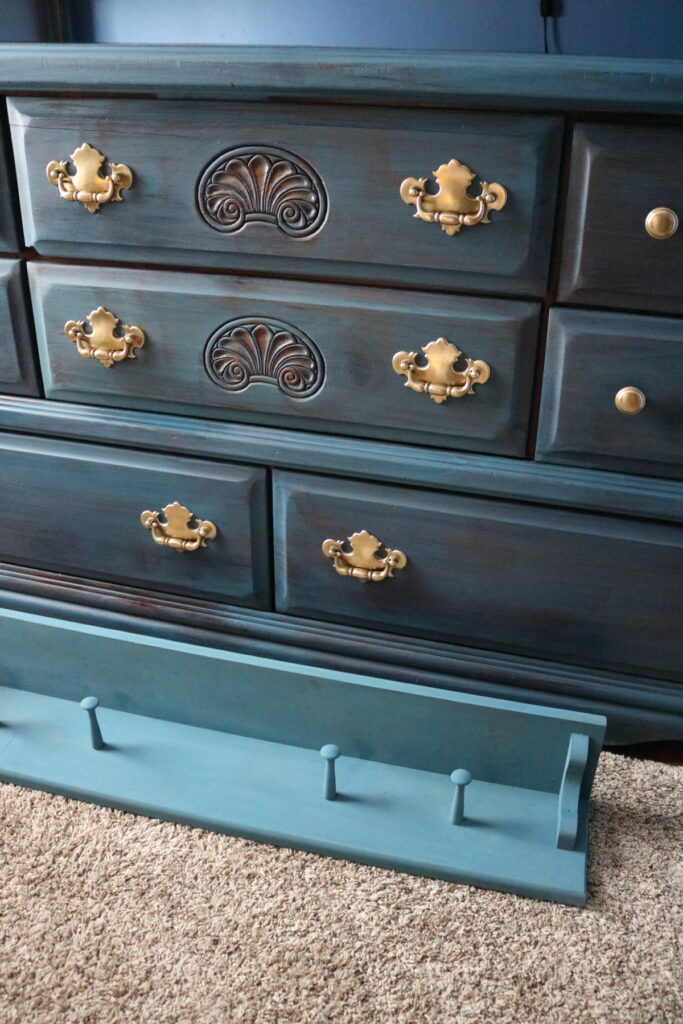 blue dresser and wall shelf