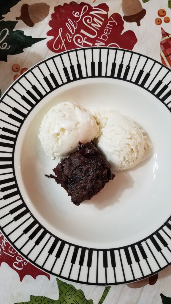 vanilla ice cream and zucchini brownie in a piano bowl