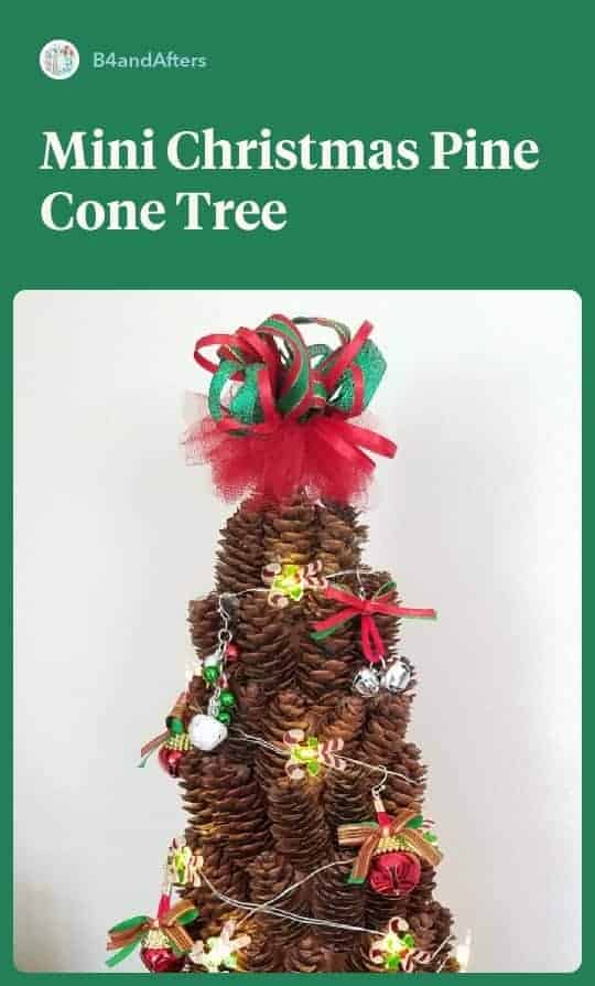 miniature pine cone tree decorated with miniature Christmas ornaments and a cute ribbon topper