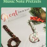music note chocolate covered pretzels on a Christmas songbook