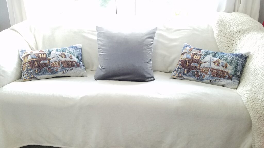 Winter Scene pillows on a couch