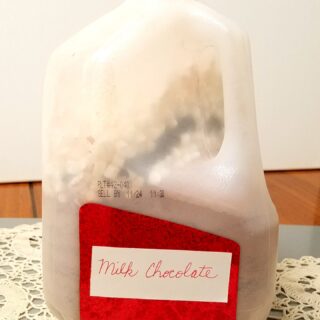 large jug of hot chocolate powder mix