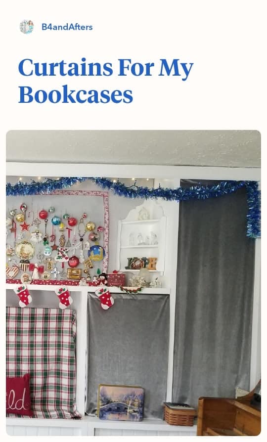 silver velvet curtains on bookcases decorated for Christmas