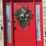 wreath made in a snowflake pattern with faux evergreens