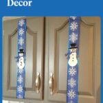 white snowmen on blue ribbon on gray cabinets