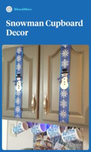 white snowmen on blue ribbon on gray cabinets