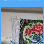 white spray painted flower stems and rose latchhook