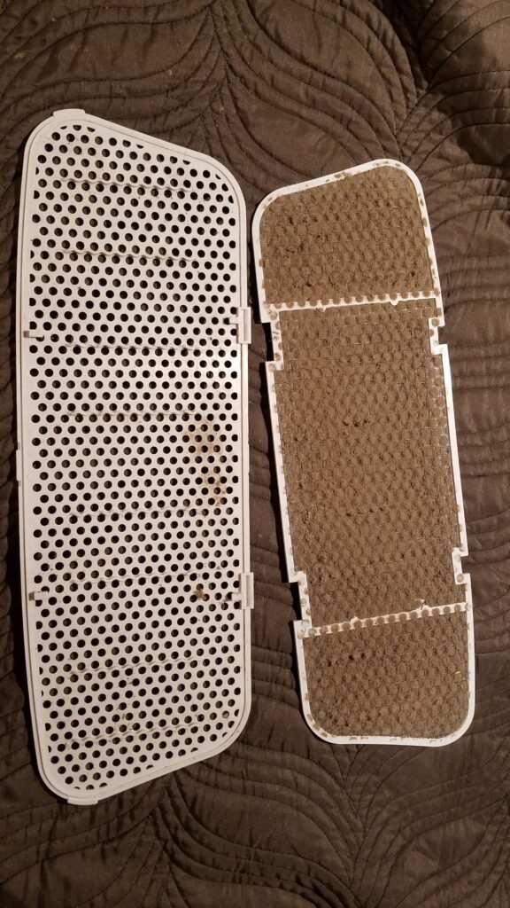 two dirty part of camper AC filter