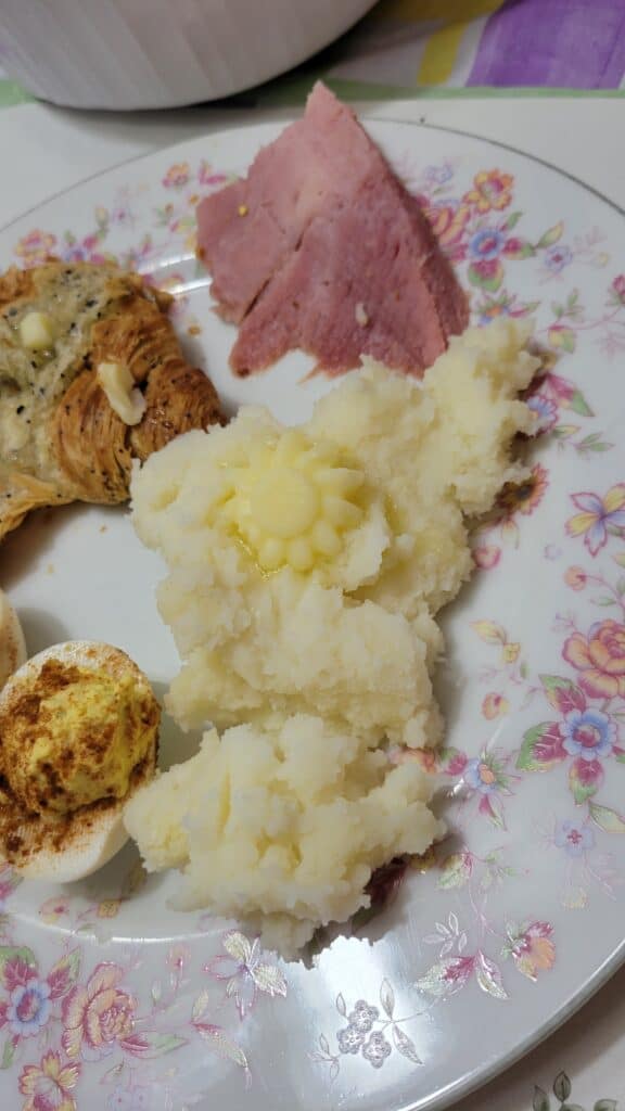 flower butter pat on mashed potatoes