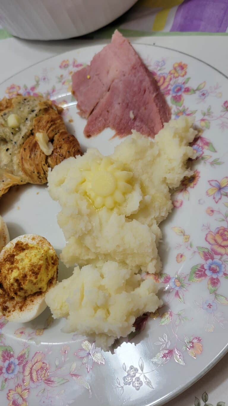 flower butter pat on mashed potatoes