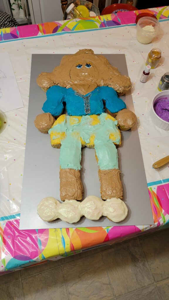 cake in shape of a doll