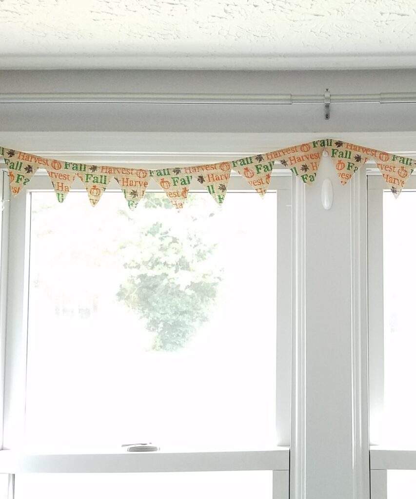 fall burlap banner at window