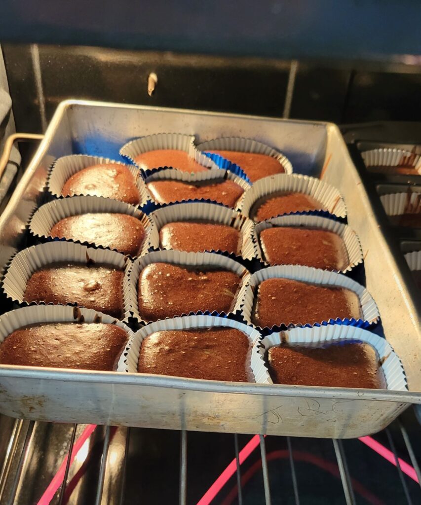 choc cupcakes baking in oven