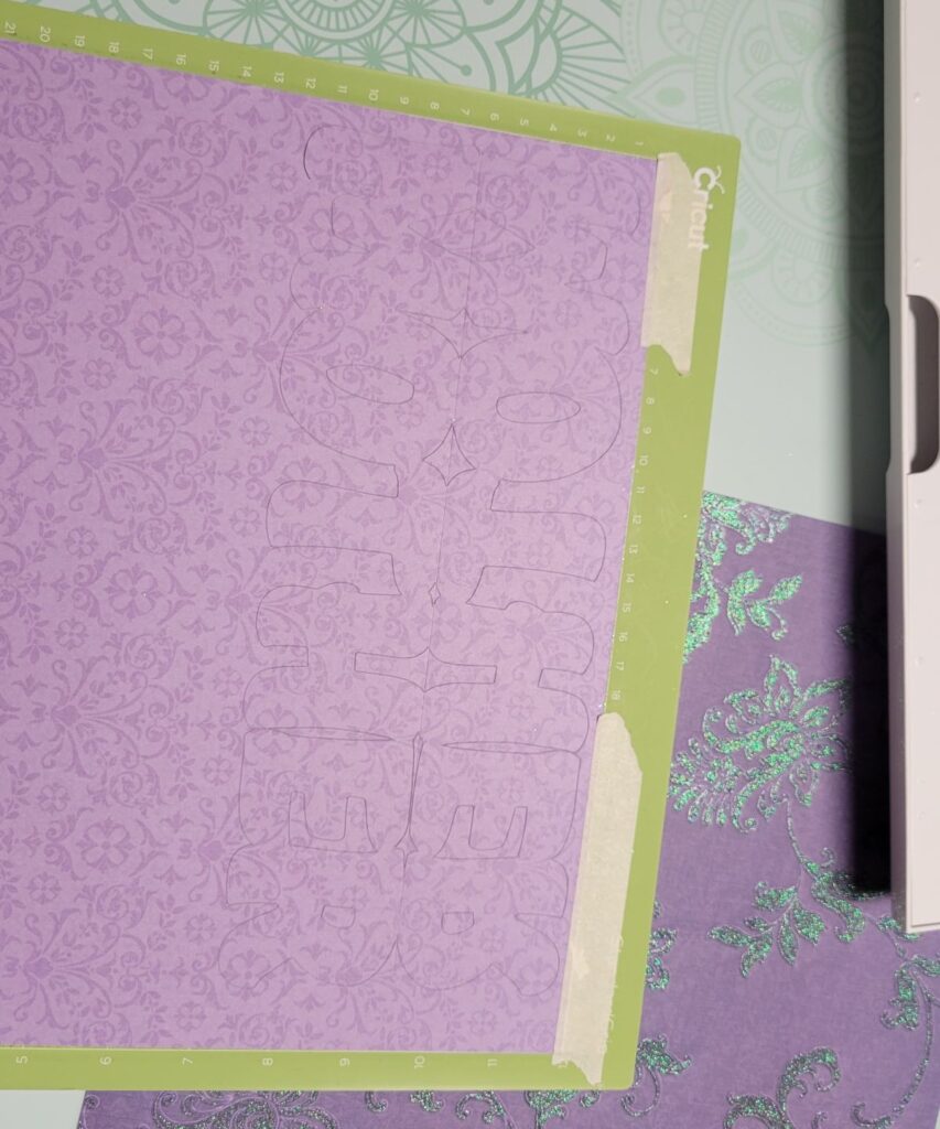 mother cut on on purple paper