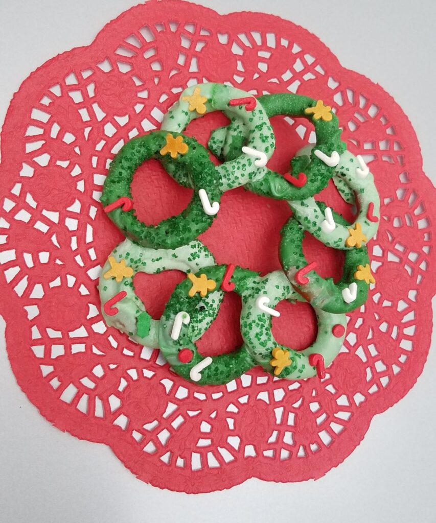 Christmas sprinkles on a chocolate covered pretzel