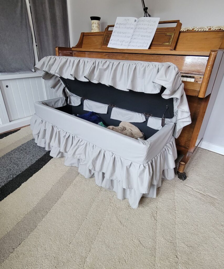 slipcovered bench with lid open