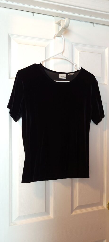 black short sleeve shirt on hanger