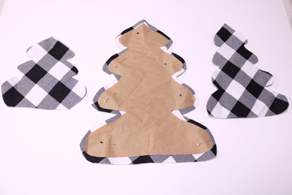 tree shape pinned and cut out on fabric