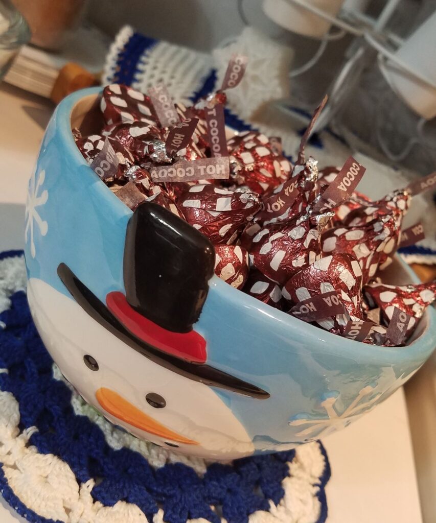 chocolate kisses in snowman bowel