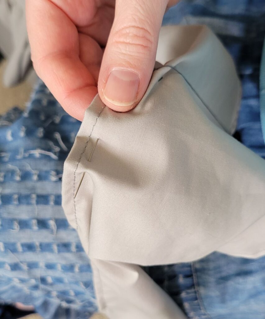 needle in gray fabric