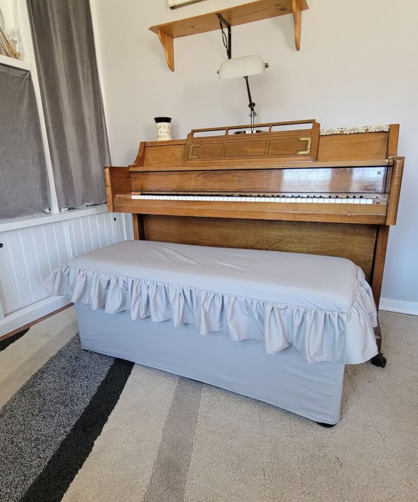 one ruffle on a piano bench