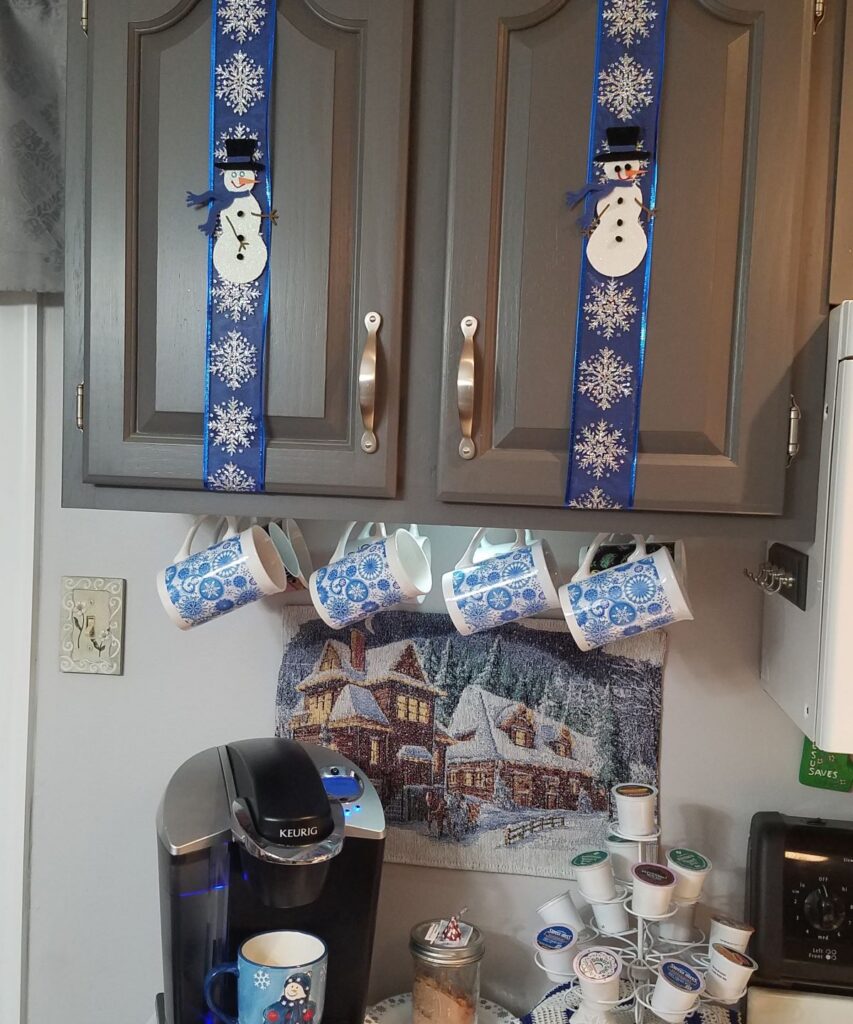 blue snowman decor on cabinets