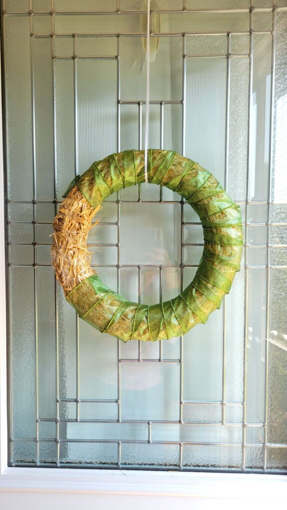 green ribbon on wreath