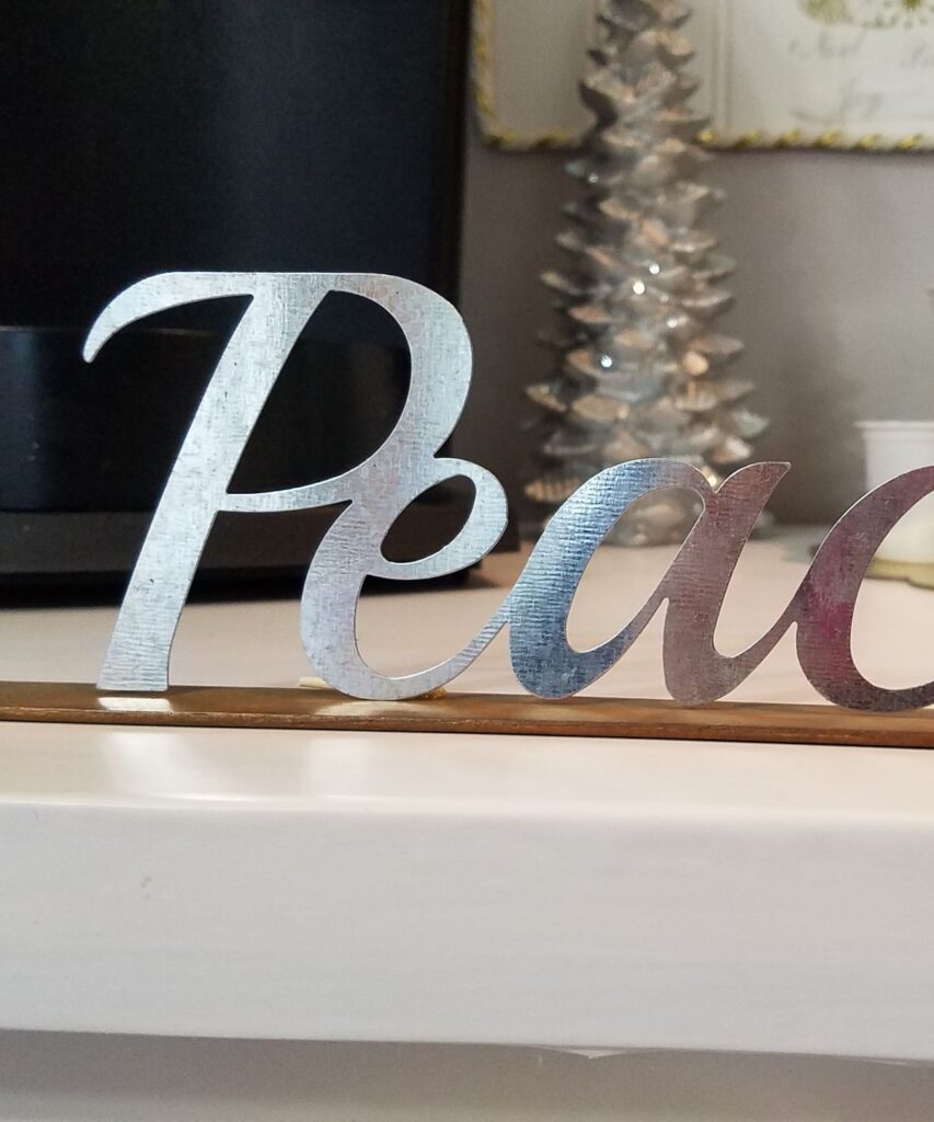 closeup of metal word Peace