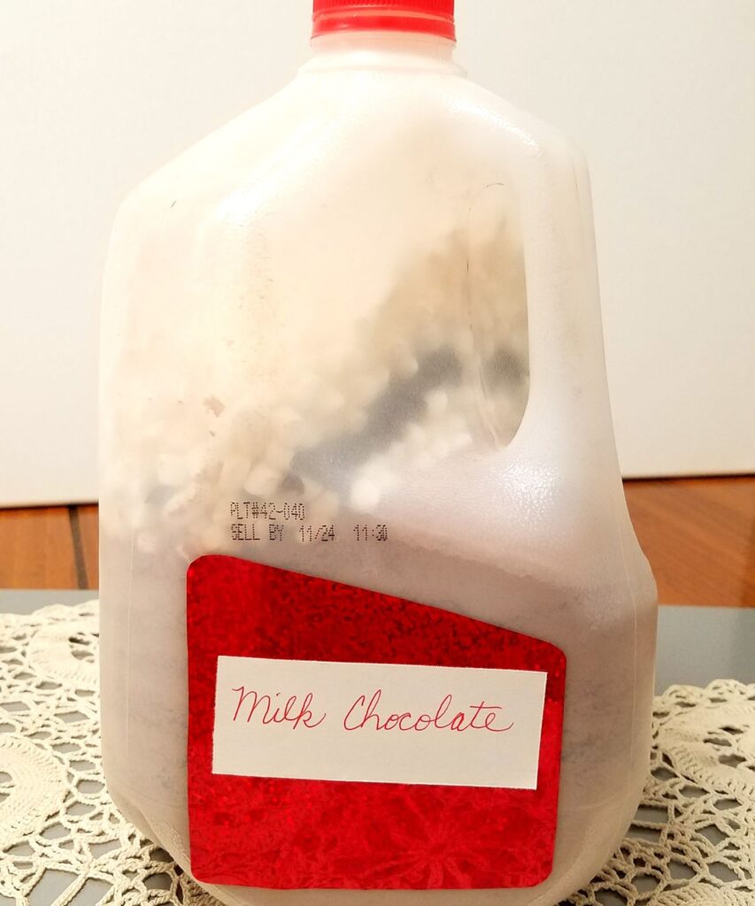 milk chocolate powder in milk jug