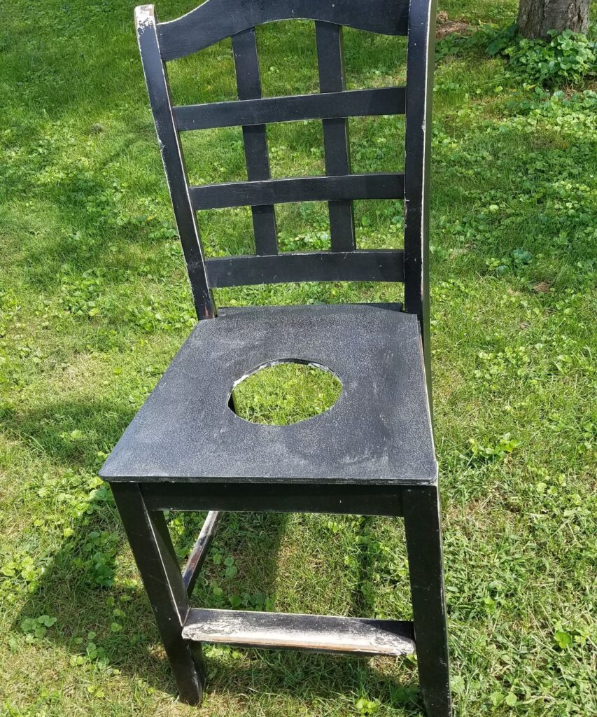 chair with a hole cut into the seat