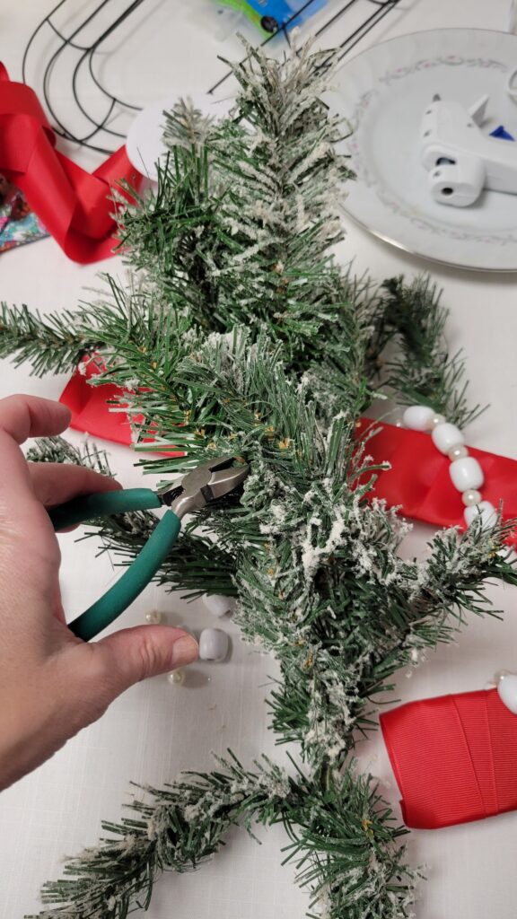 cutting faux Christmas branch