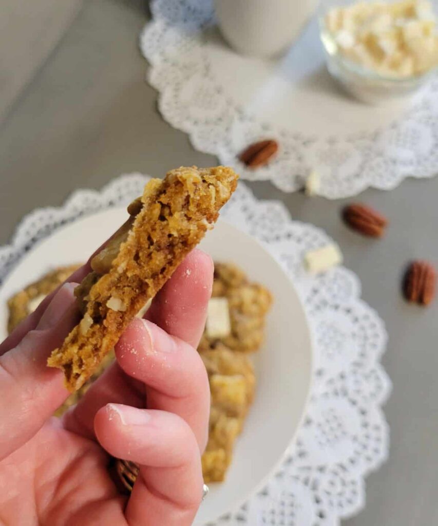 broken cookie in hand