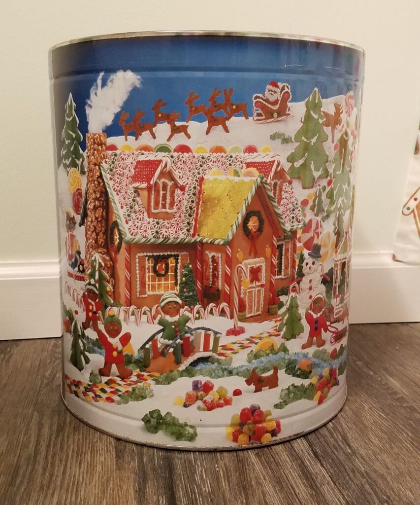 gingerbread scene on a tin