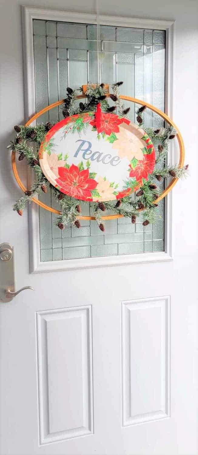Oval Christmas platter wreath on white door