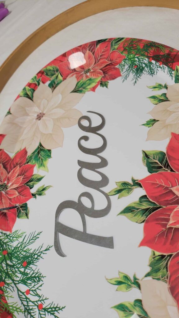 metal word on plastic Christmas platter