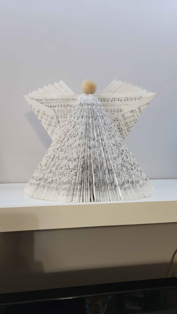 wooden head too small on book angel