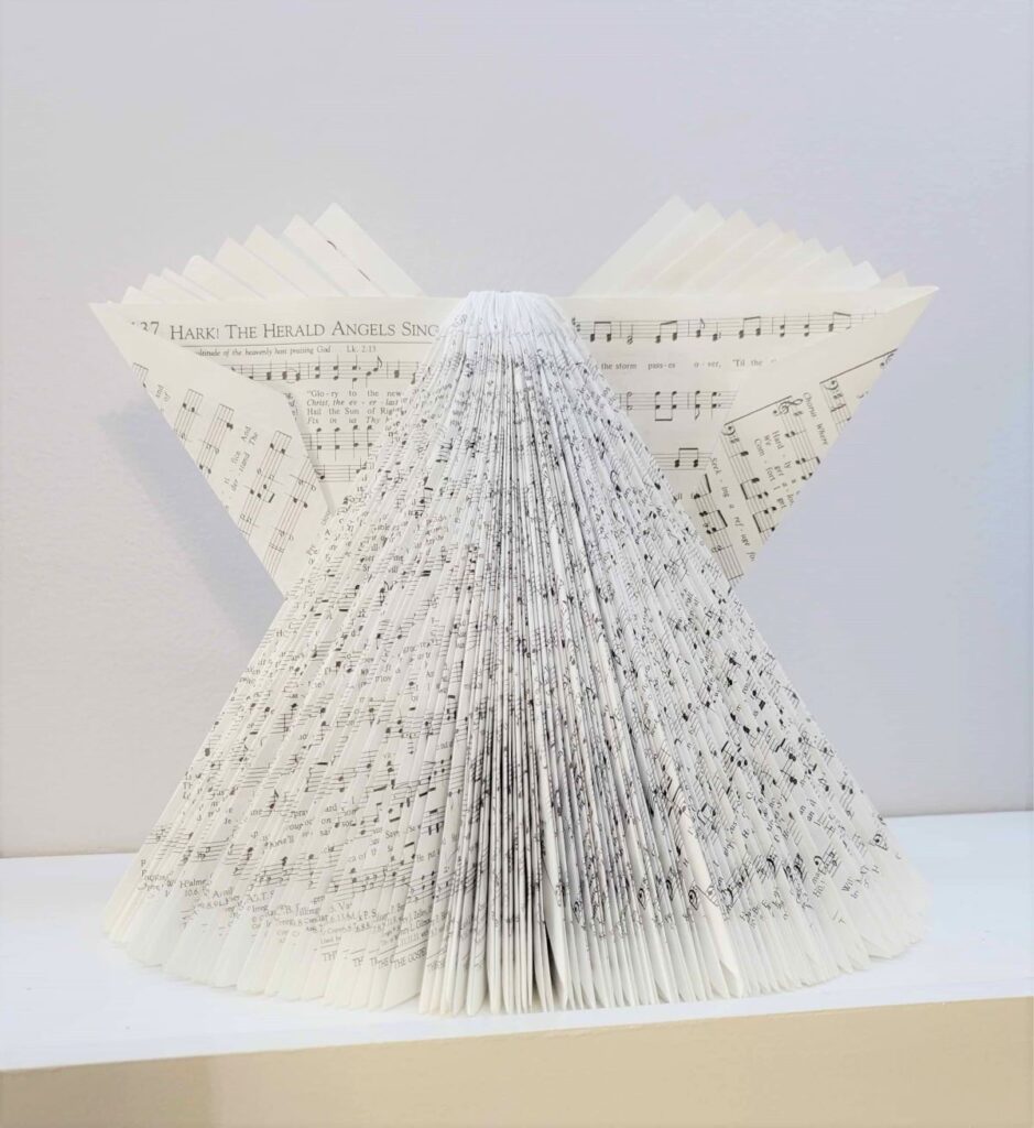 music pages folded into an angel shape