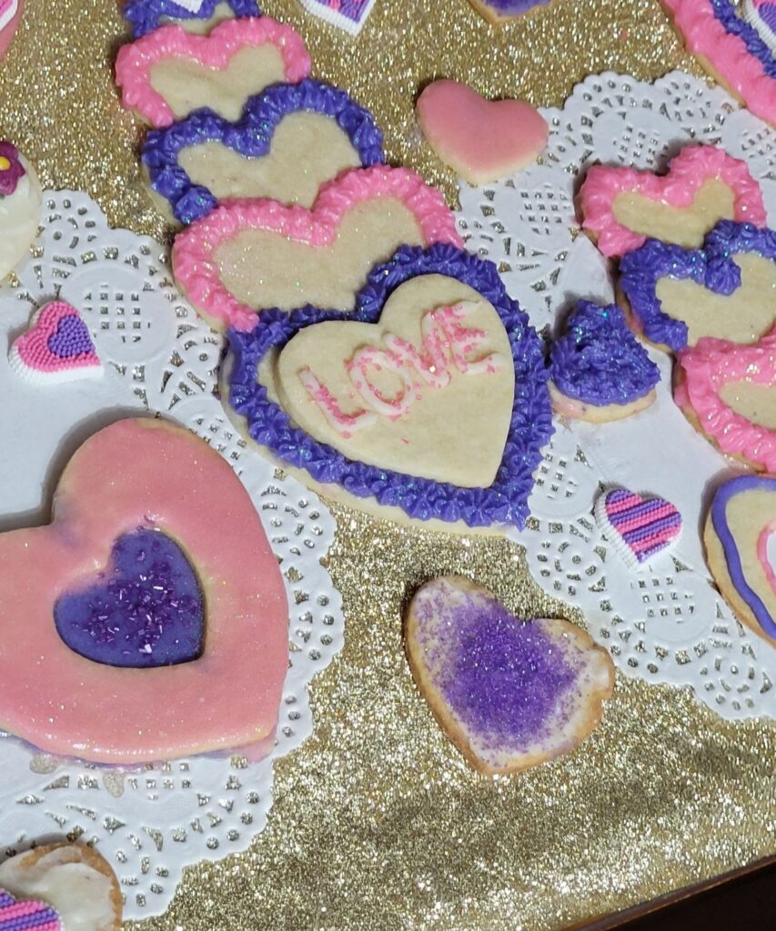 collection of pink and purple valentine cookies