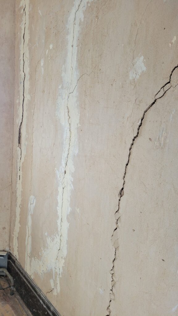 3 big cracks in wall