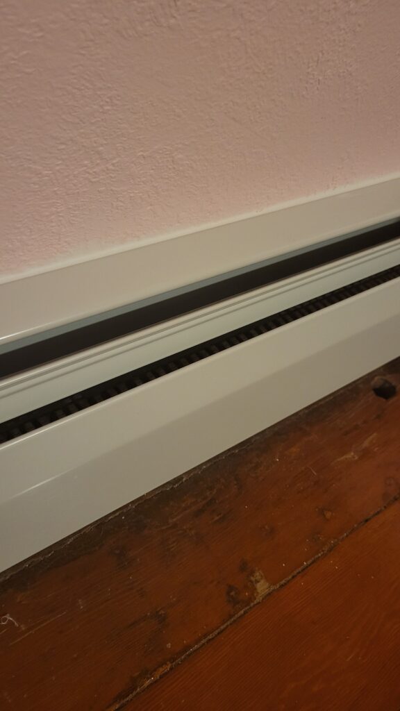 caulking baseboard heat cover