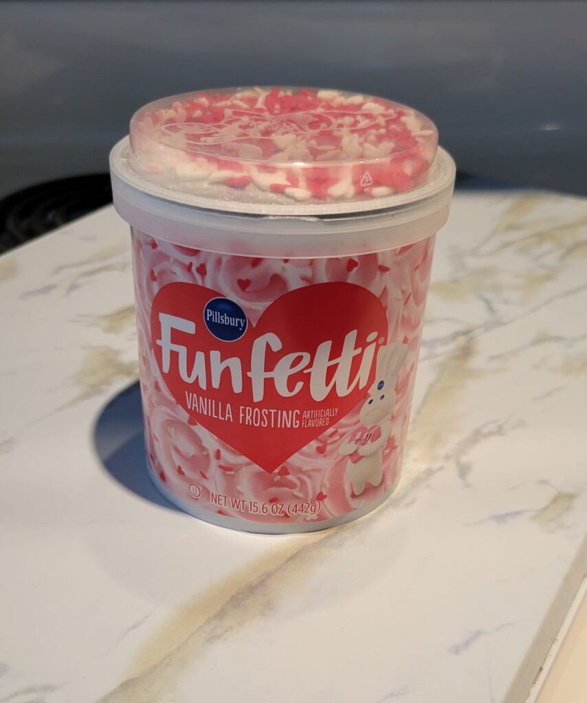 pink funfetti frosting with sprinkles